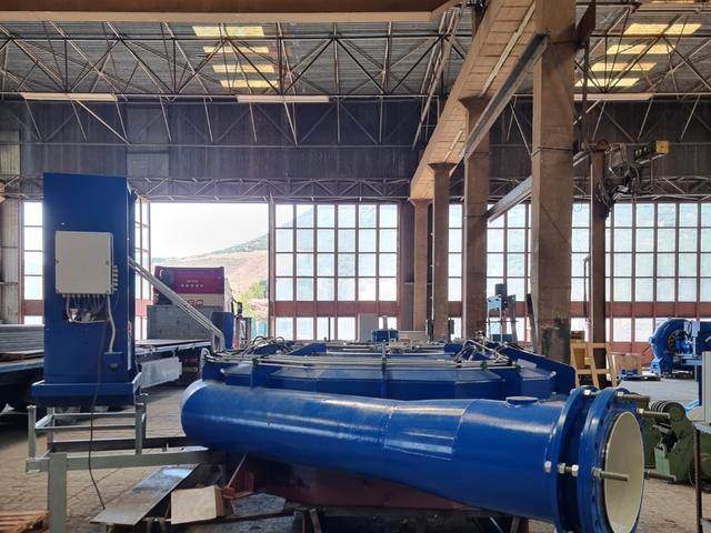 Fabricated and coated assembly with inspection covers and control cabinet