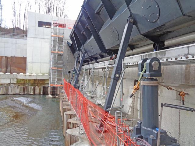 Flap gates with hydraulic cylinders during installation